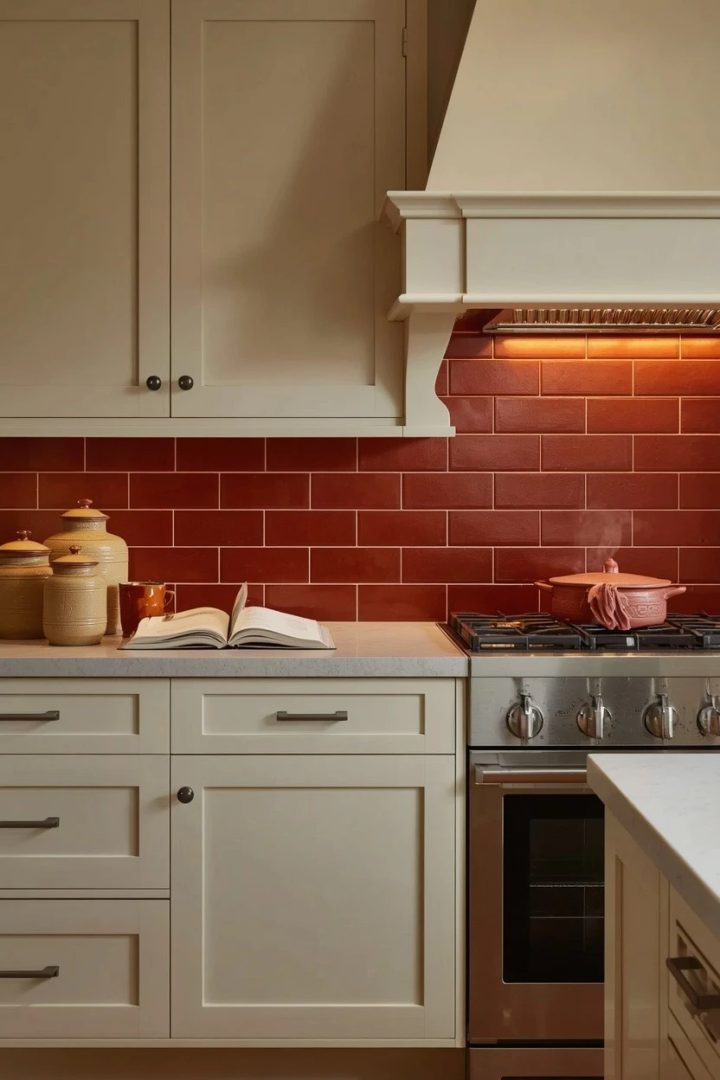 1. Use Cream Cabinets with a Rust Backsplash