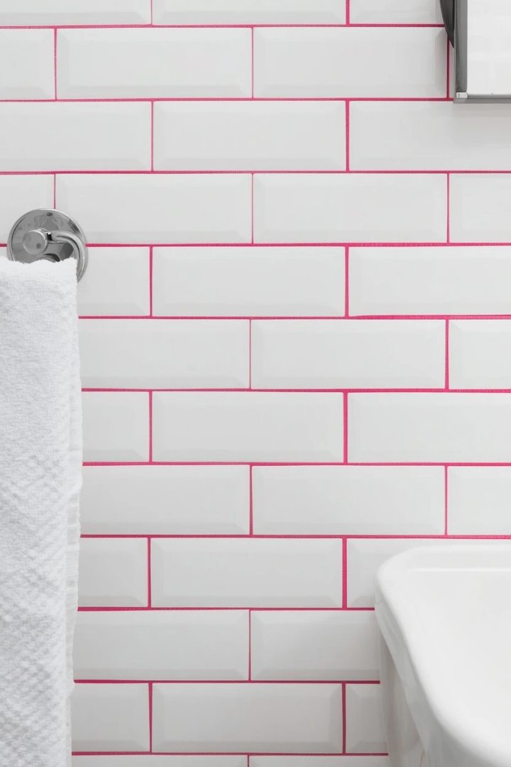 3. White Subway Tiles With Hot Pink Grout