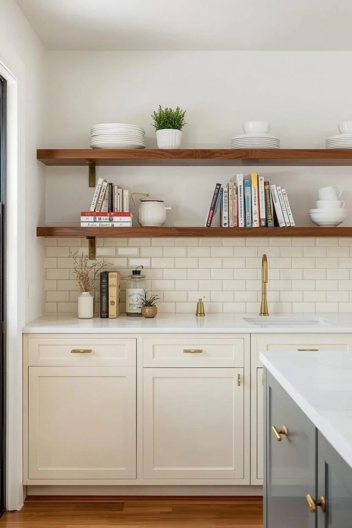 13. Curved Caramel Floating Shelves Over Cream Cabinets