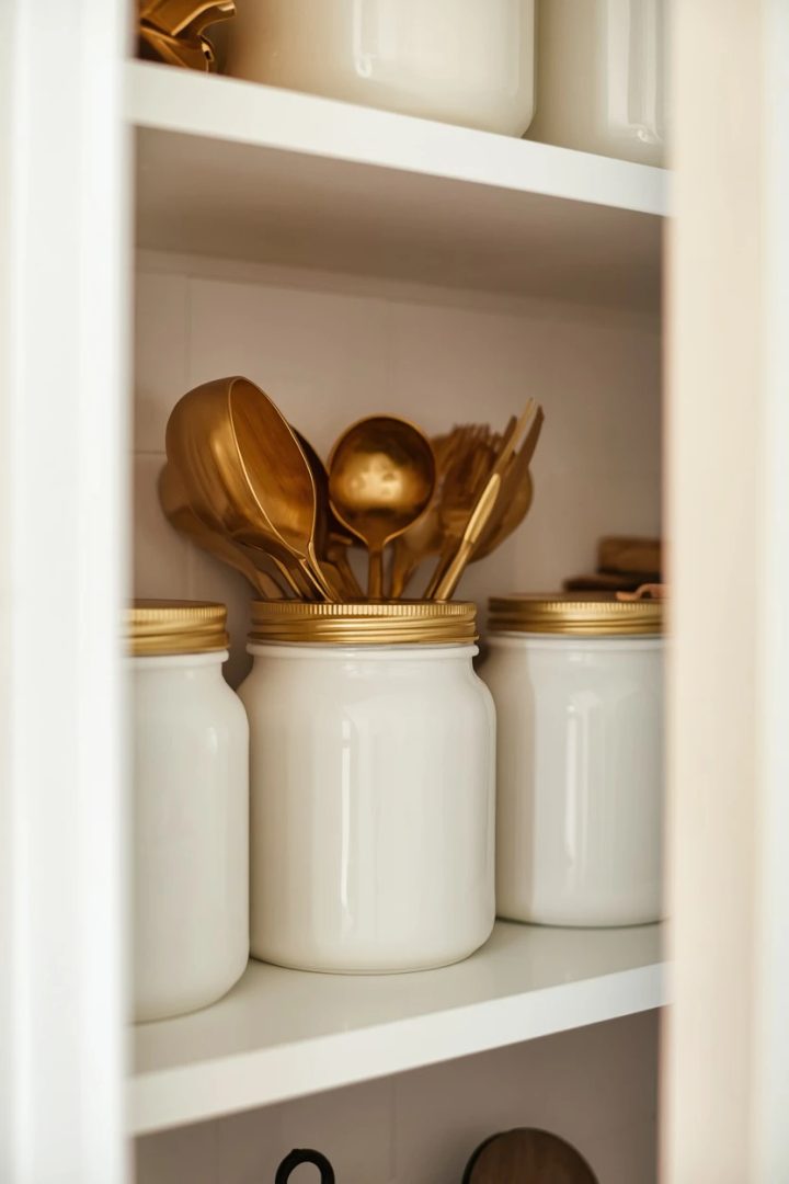 10. The Gold Scoops and Utensils With White Jars