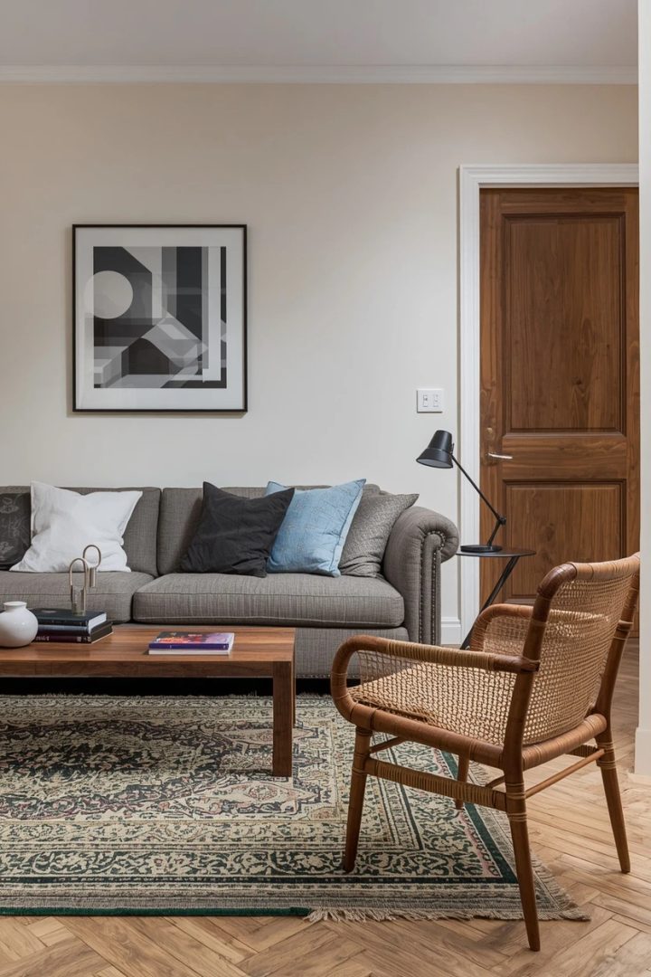 grey settee warmed with natural wood tones